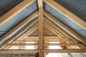 Attic space of a building under construction with wooden beams