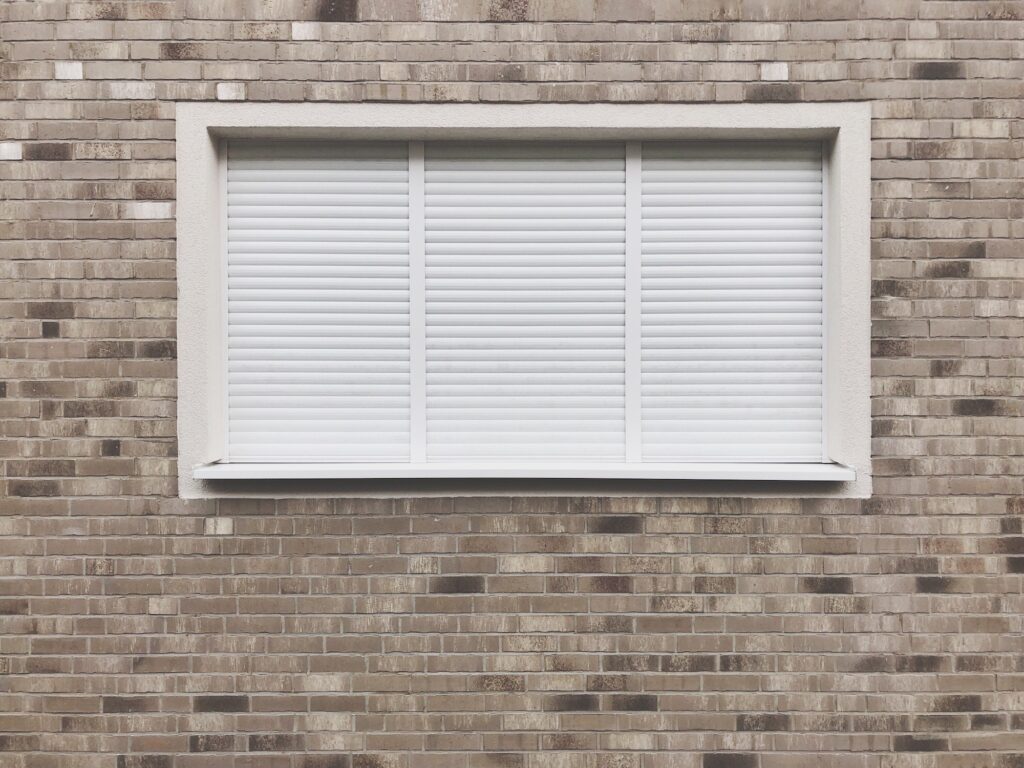 Window with closed roller shutter blinds